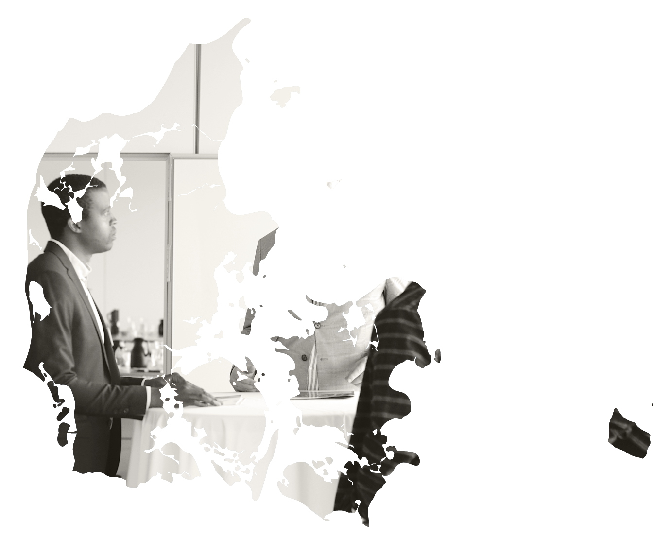 Man presenting at a business meeting table